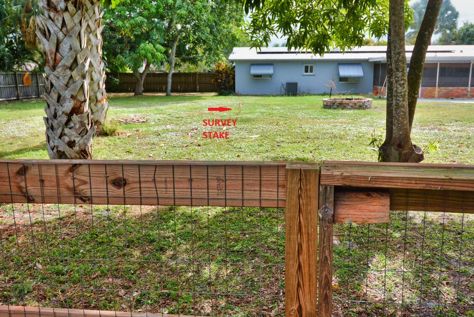 Tbd Southeast Iris Street Stuart, FL 34997 - Photo 24 of 33 a front view of a house with garden