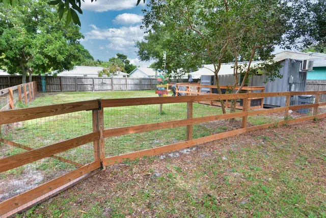 a view of a chairs and table on the wooden floor