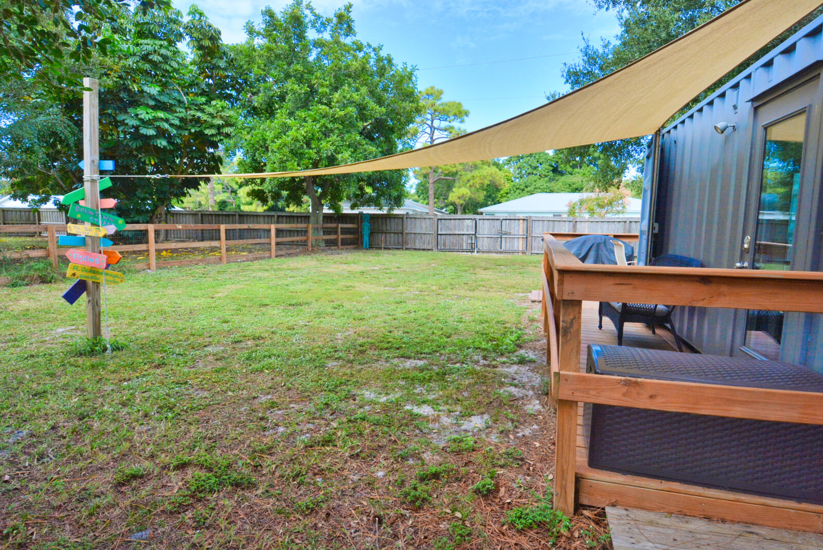 Tbd Southeast Iris Street Stuart, FL 34997 - Photo 5 of 33 a view of a yard with a wooden fence