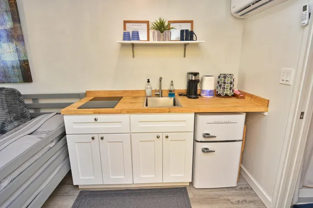 a utility room with sink dryer and washer