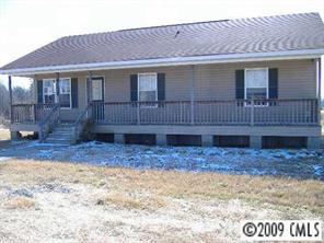 4609 Griffith Road Monroe, NC 28112 - Photo 1 of 8 a view of a house with a yard