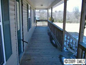 4609 Griffith Road Monroe, NC 28112 - Photo 6 of 8 a view of a street with balcony and wooden floor