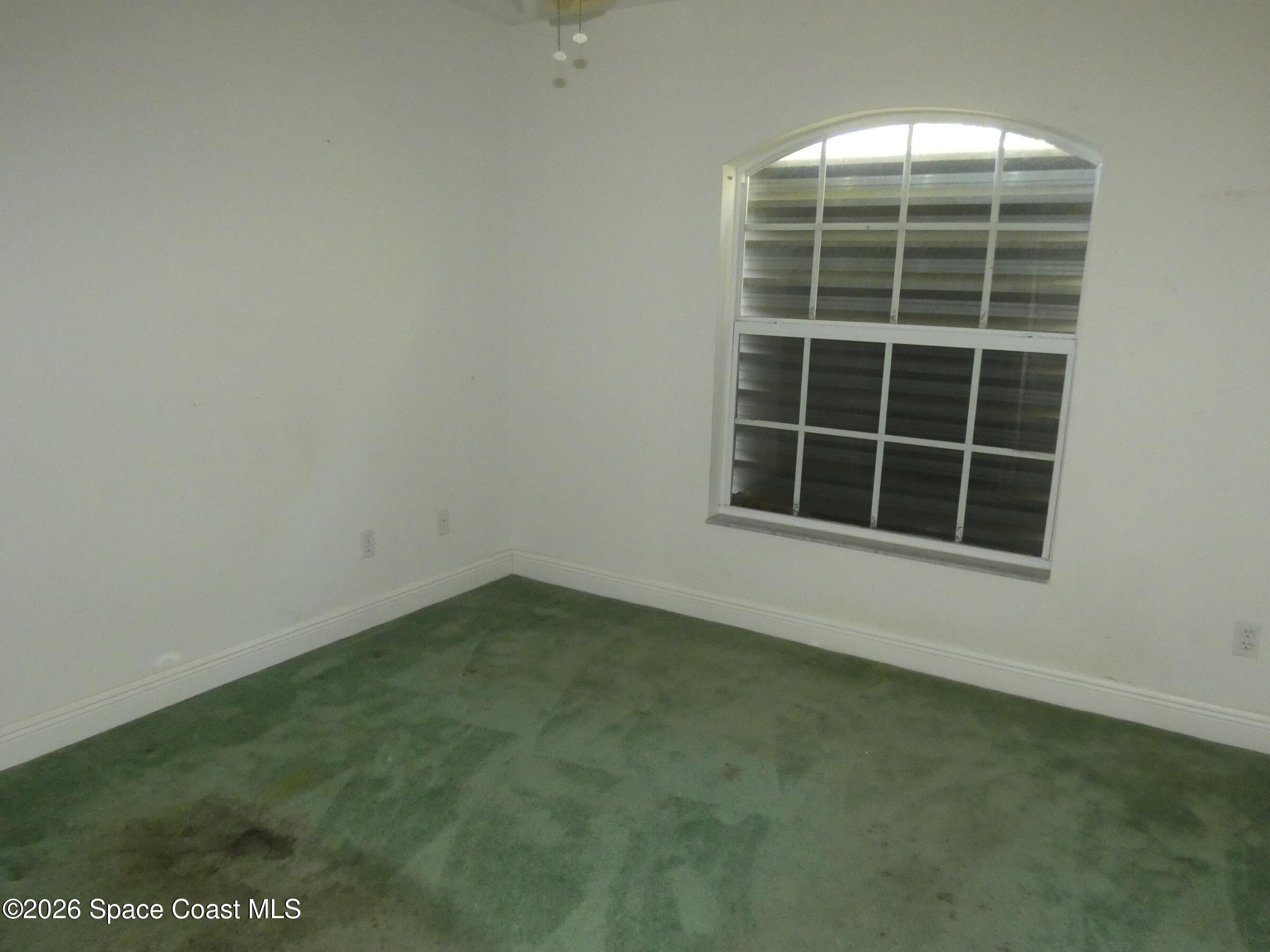 3195 Legendary Lane Melbourne, FL 32935 - Photo 17 of 25 a view of empty room with windows