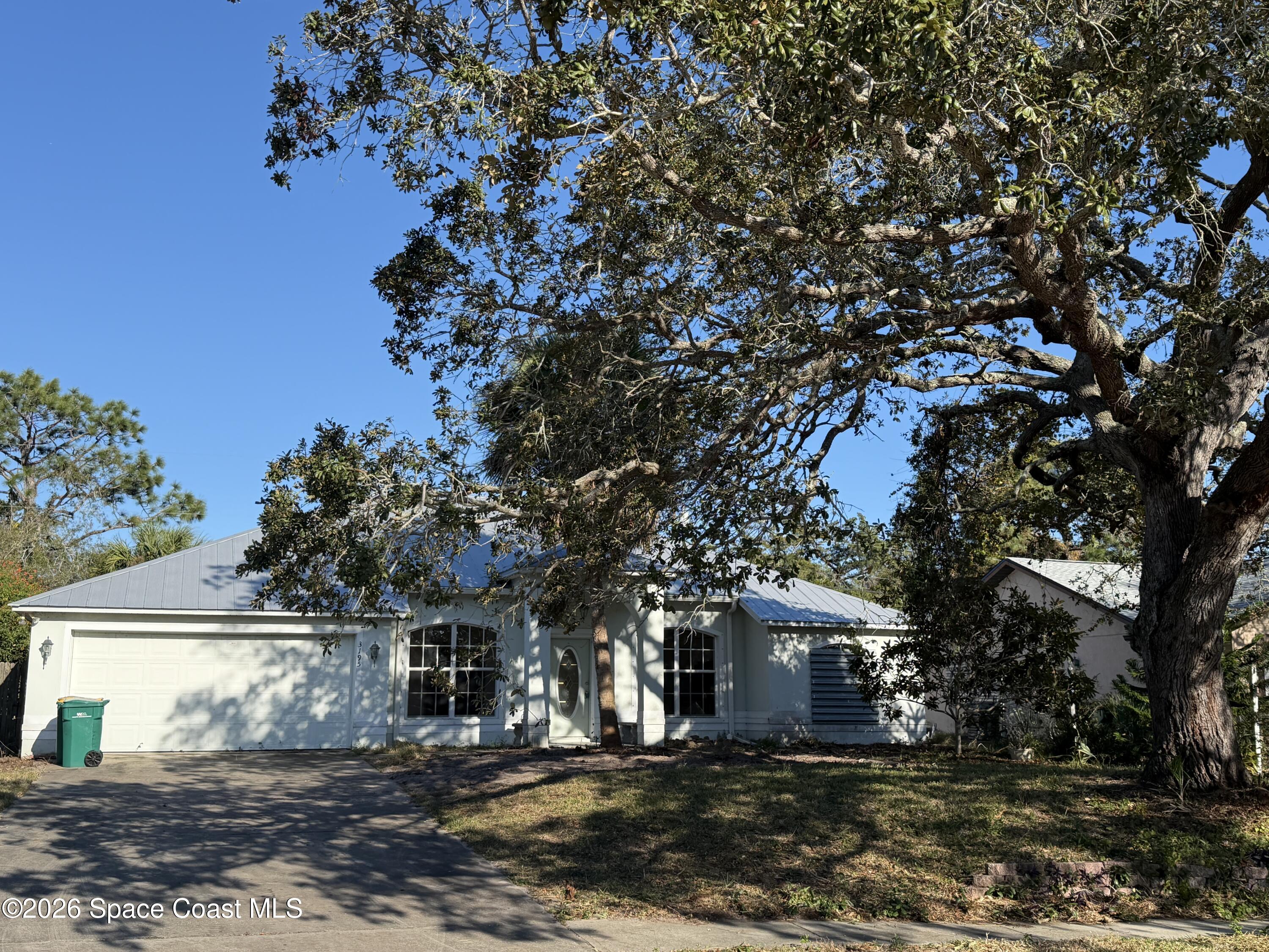 3195 Legendary Lane Melbourne, FL 32935 - Photo 25 of 25 a front view of a house with a tree
