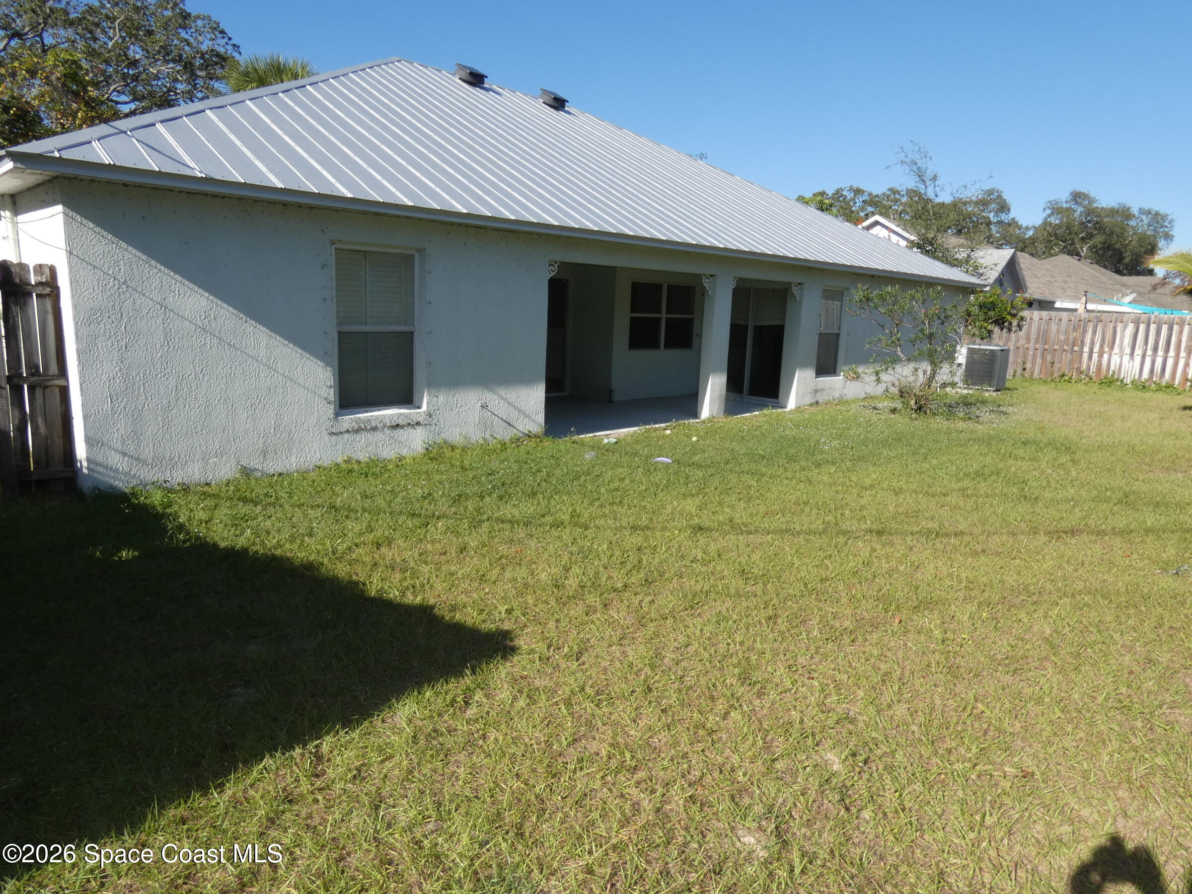 3195 Legendary Lane Melbourne, FL 32935 - Photo 3 of 25 a front view of a house with garden