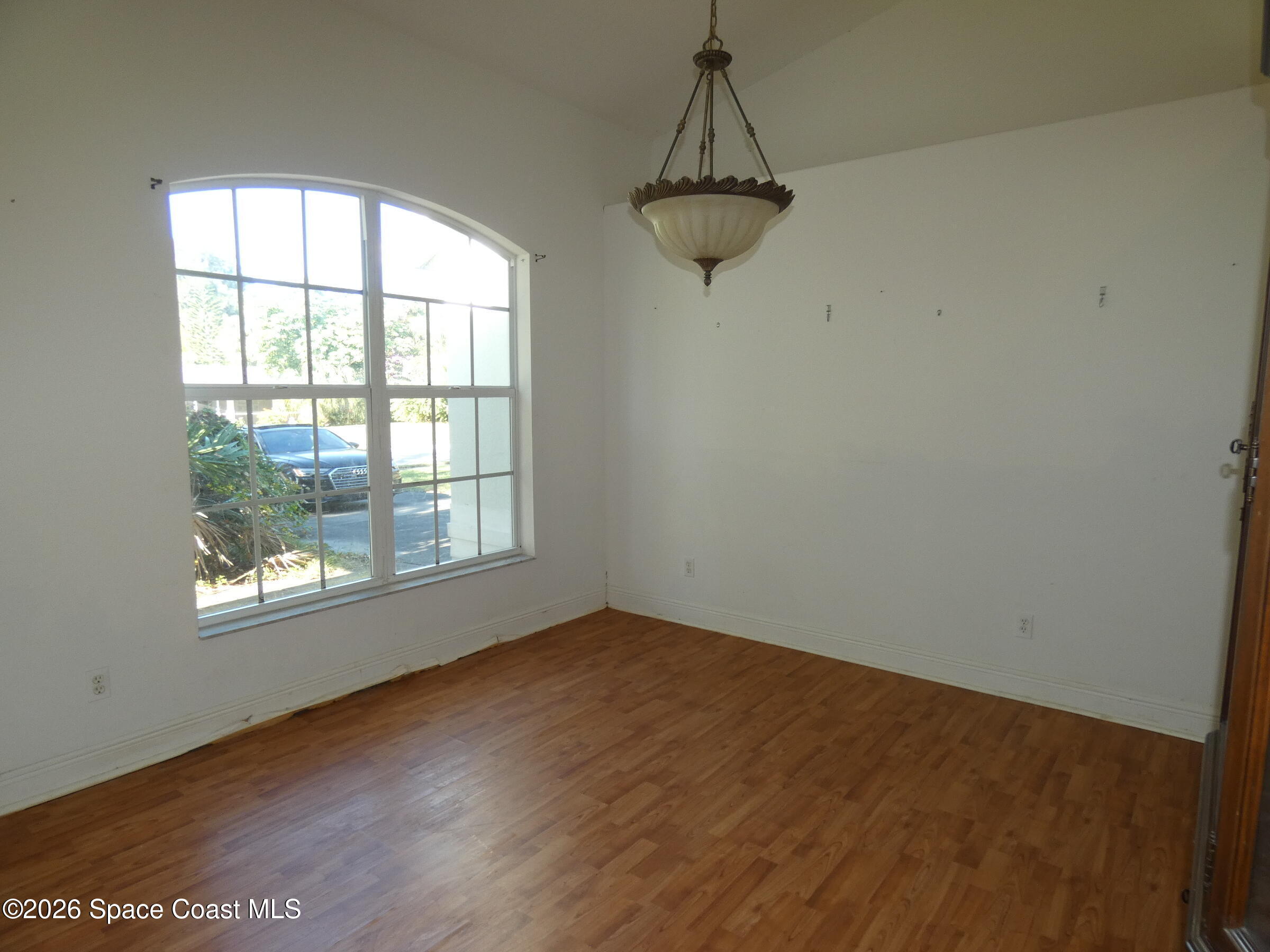 3195 Legendary Lane Melbourne, FL 32935 - Photo 7 of 25 an empty room with a window