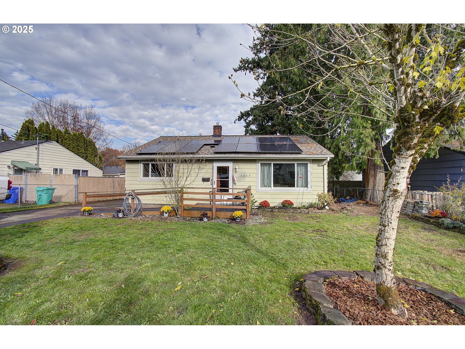a front view of house with yard and seating area