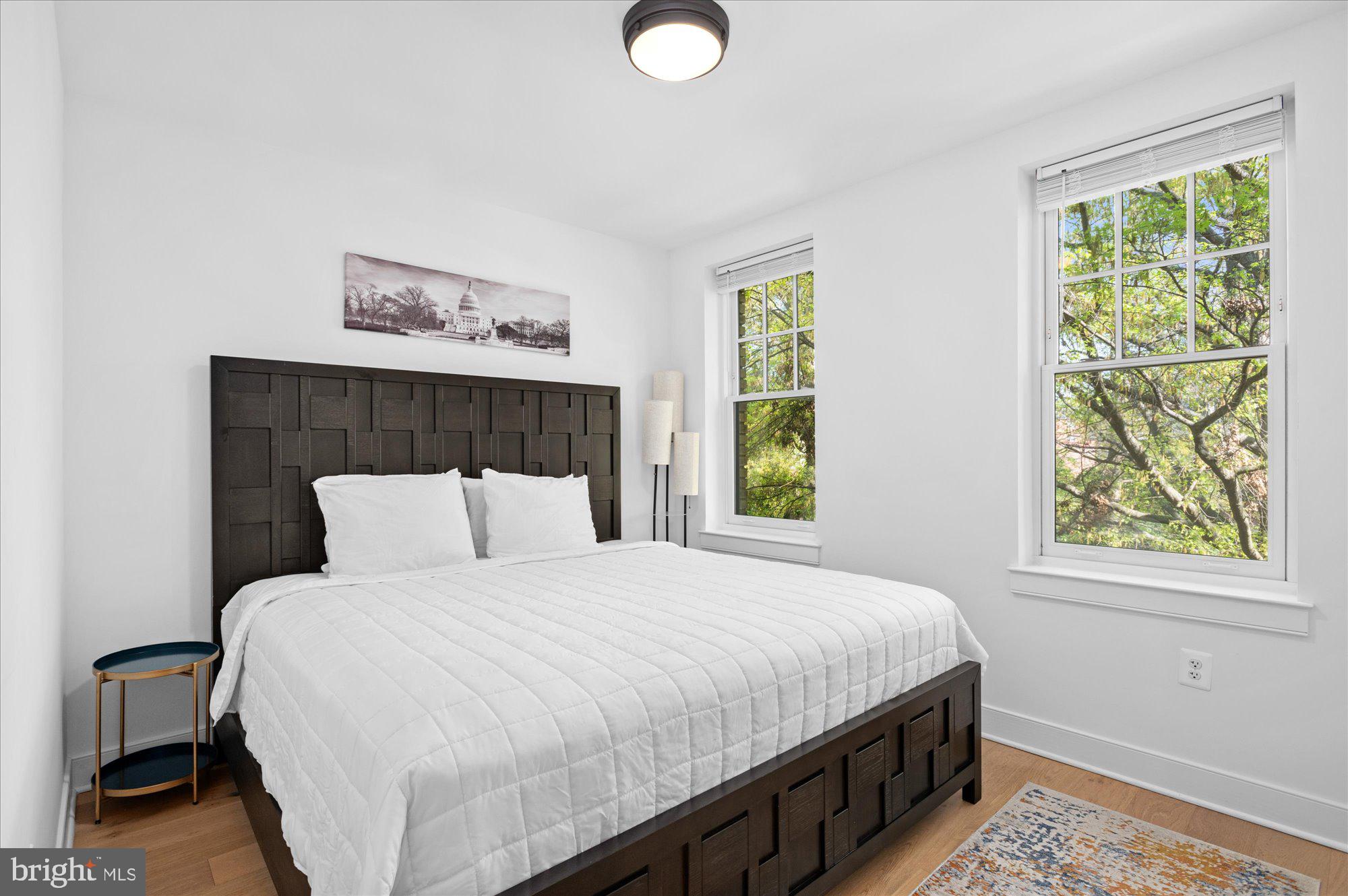 2869 28th Street Northwest, Unit 301 Washington, DC 20008 - Photo 17 of 31 a bedroom with a bed and a window