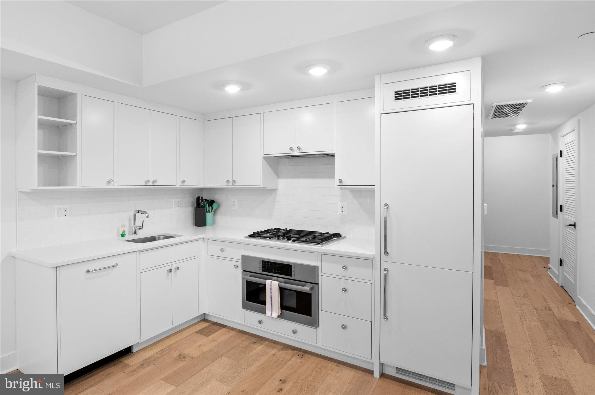 2869 28th Street Northwest, Unit 301 Washington, DC 20008 - Photo 8 of 31 a kitchen with a stove oven and sink