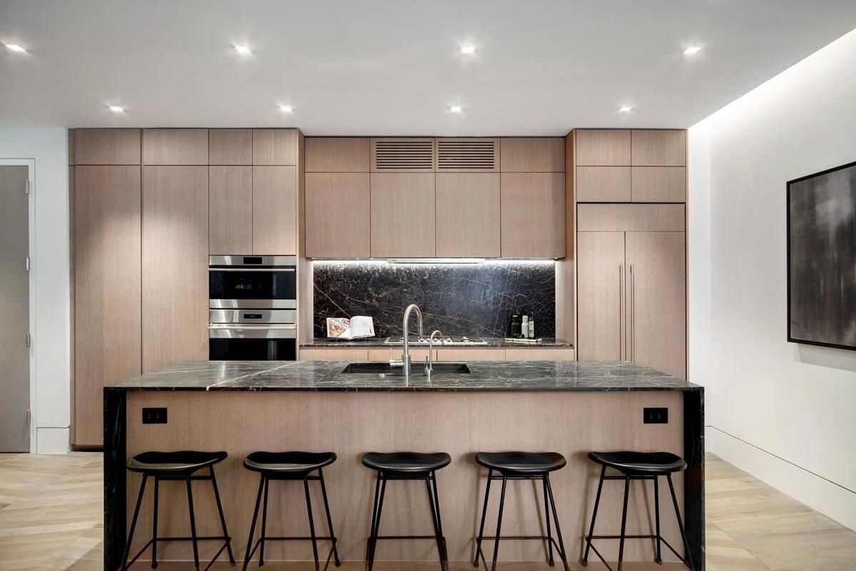 49 Chambers Street, Unit 16C Manhattan, NY 10007 - Photo 1 of 19 a kitchen with appliances cabinets and a sink