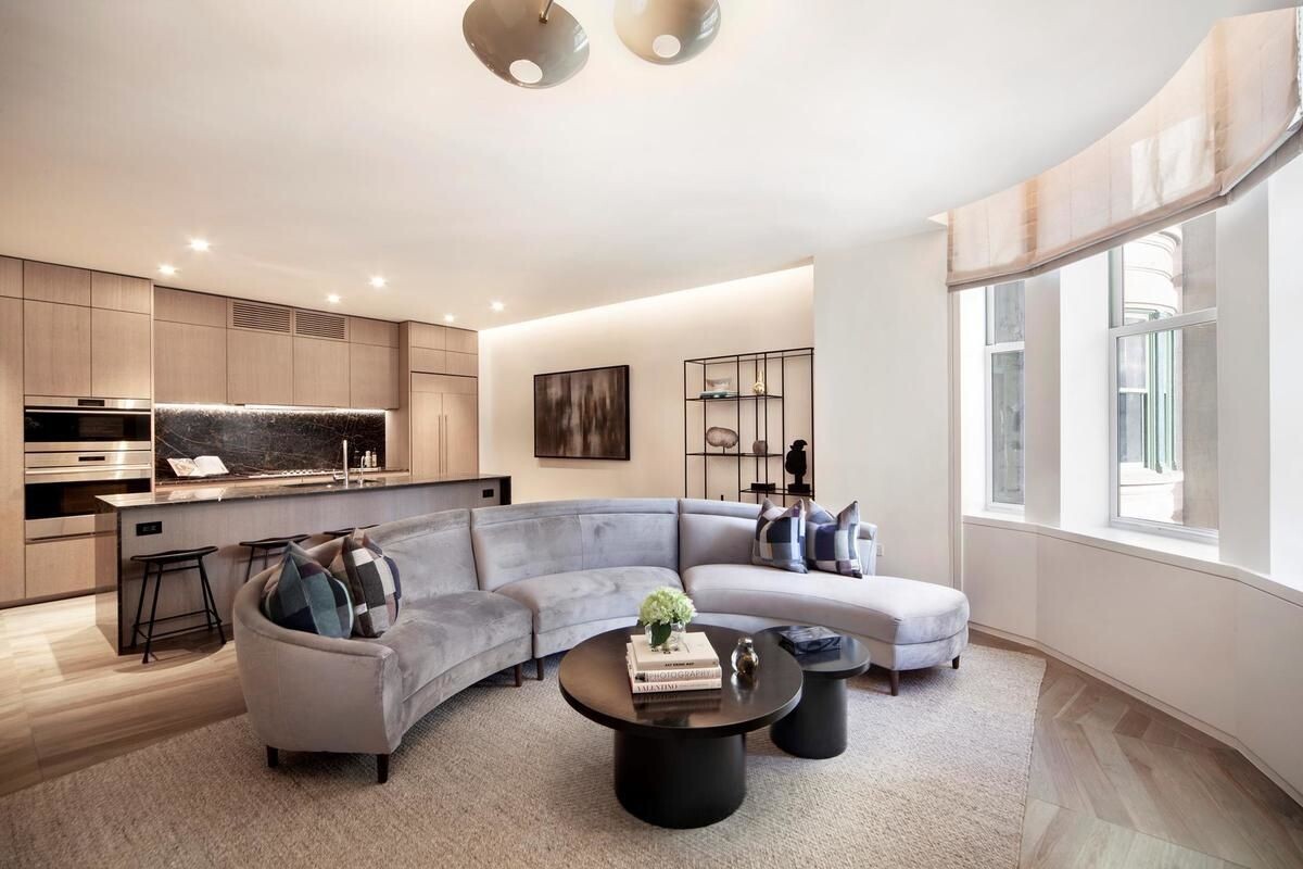 49 Chambers Street, Unit 16C Manhattan, NY 10007 - Photo 2 of 19 a living room with furniture and a large window