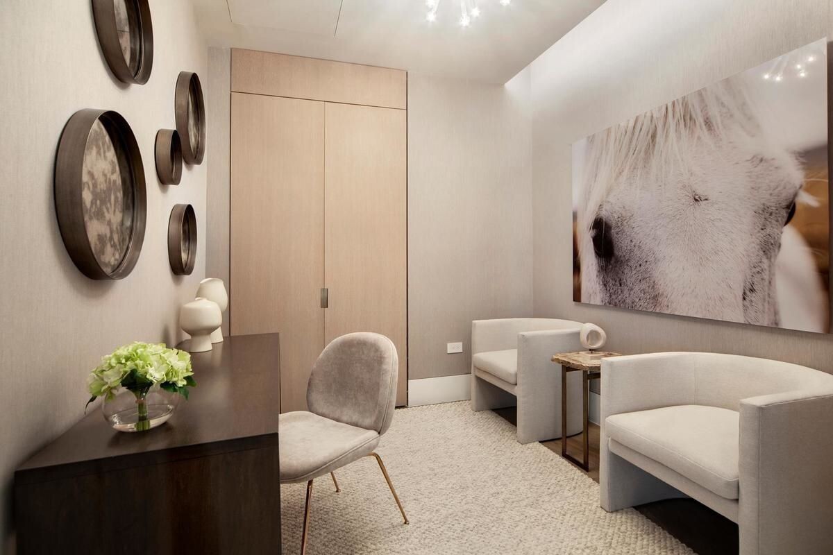 49 Chambers Street, Unit 16C Manhattan, NY 10007 - Photo 5 of 19 a bathroom with a toilet a sink and a mirror
