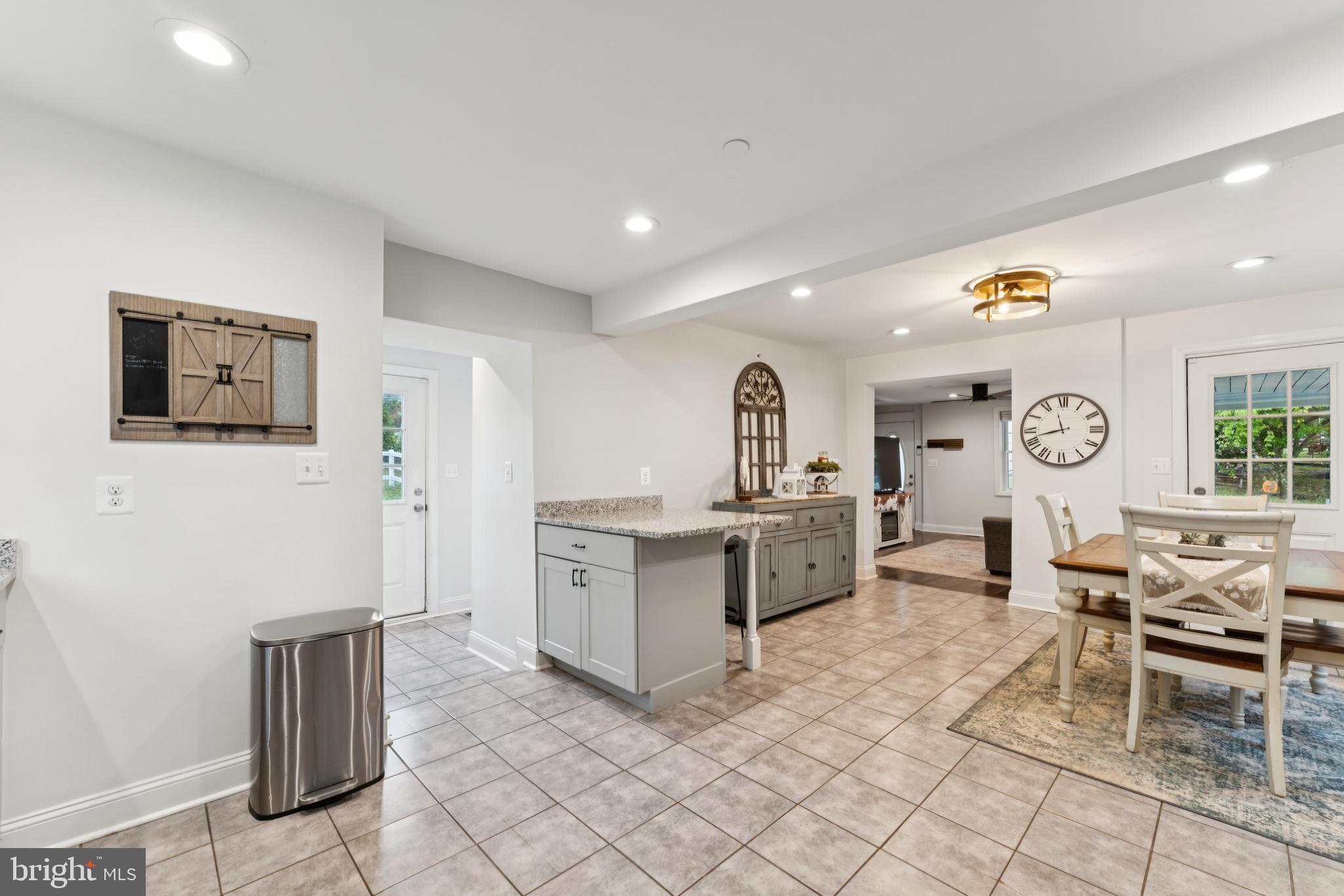 2372 Mayberry Road Westminster, MD 21158 - Photo 13 of 38 a living room with furniture a clock and a window