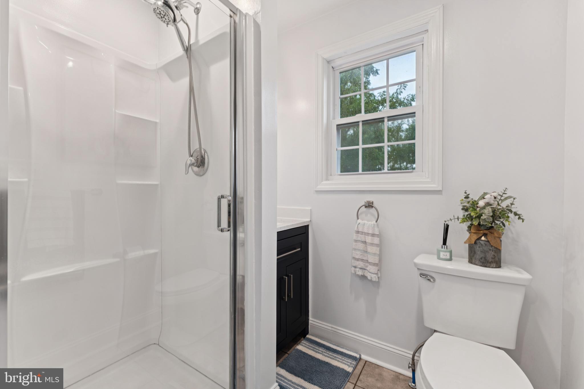 2372 Mayberry Road Westminster, MD 21158 - Photo 18 of 38 a bathroom with a toilet and a shower