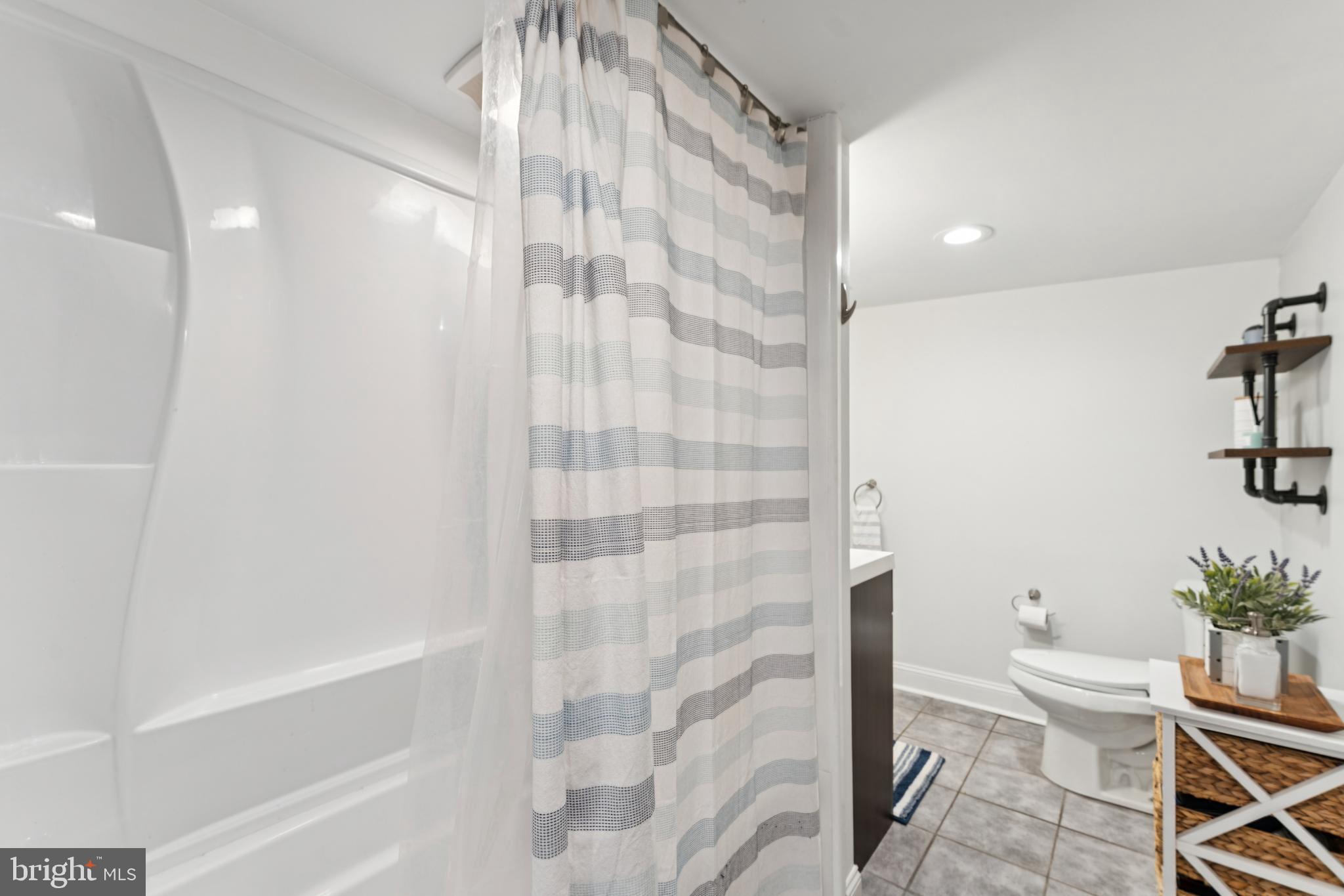 2372 Mayberry Road Westminster, MD 21158 - Photo 21 of 38 a bathroom with a toilet and a shower