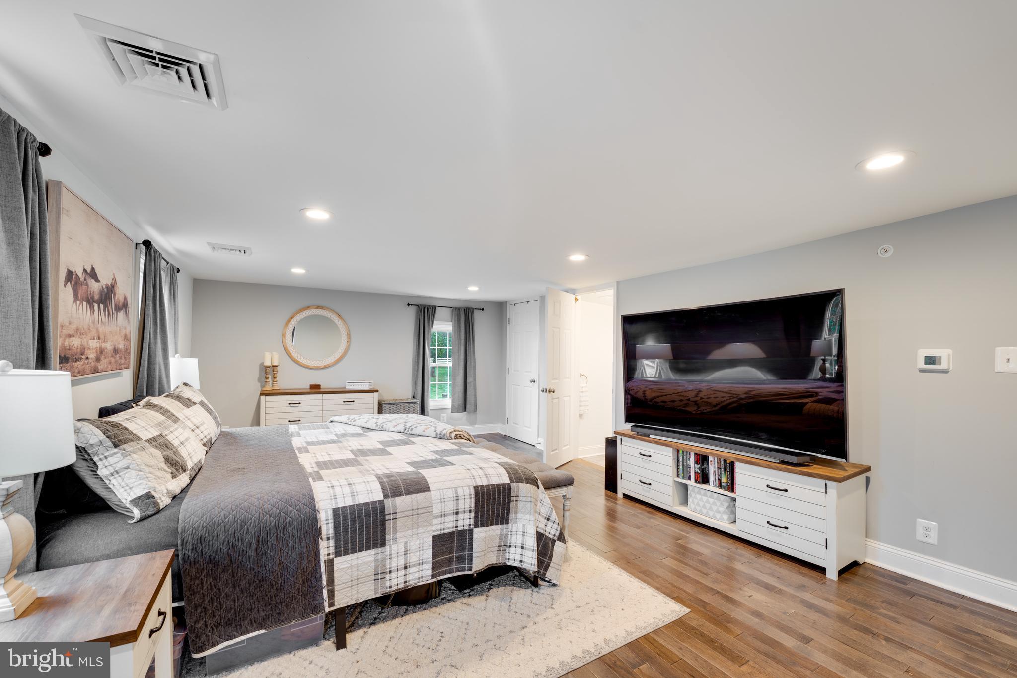 2372 Mayberry Road Westminster, MD 21158 - Photo 26 of 38 a bedroom with a bed and a flat screen tv