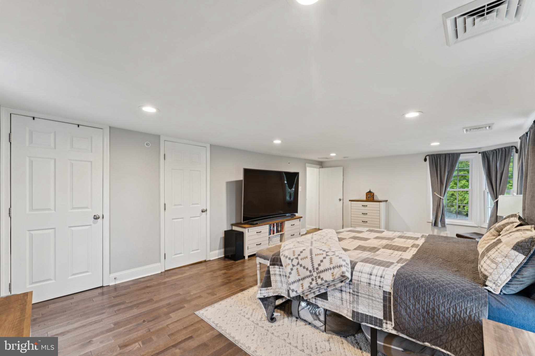 2372 Mayberry Road Westminster, MD 21158 - Photo 28 of 38 a bedroom with a bed tv and wooden floor
