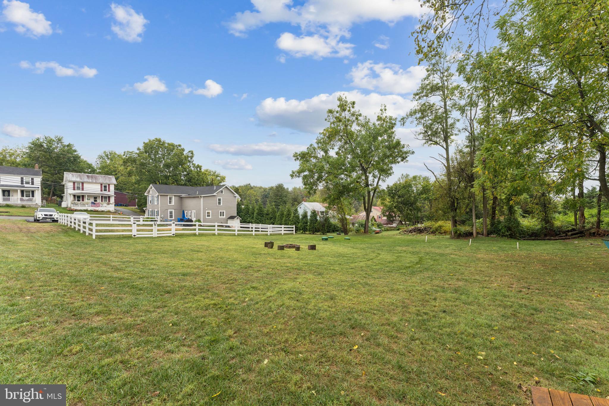 2372 Mayberry Road Westminster, MD 21158 - Photo 31 of 38 a view of yard with swimming pool and trees