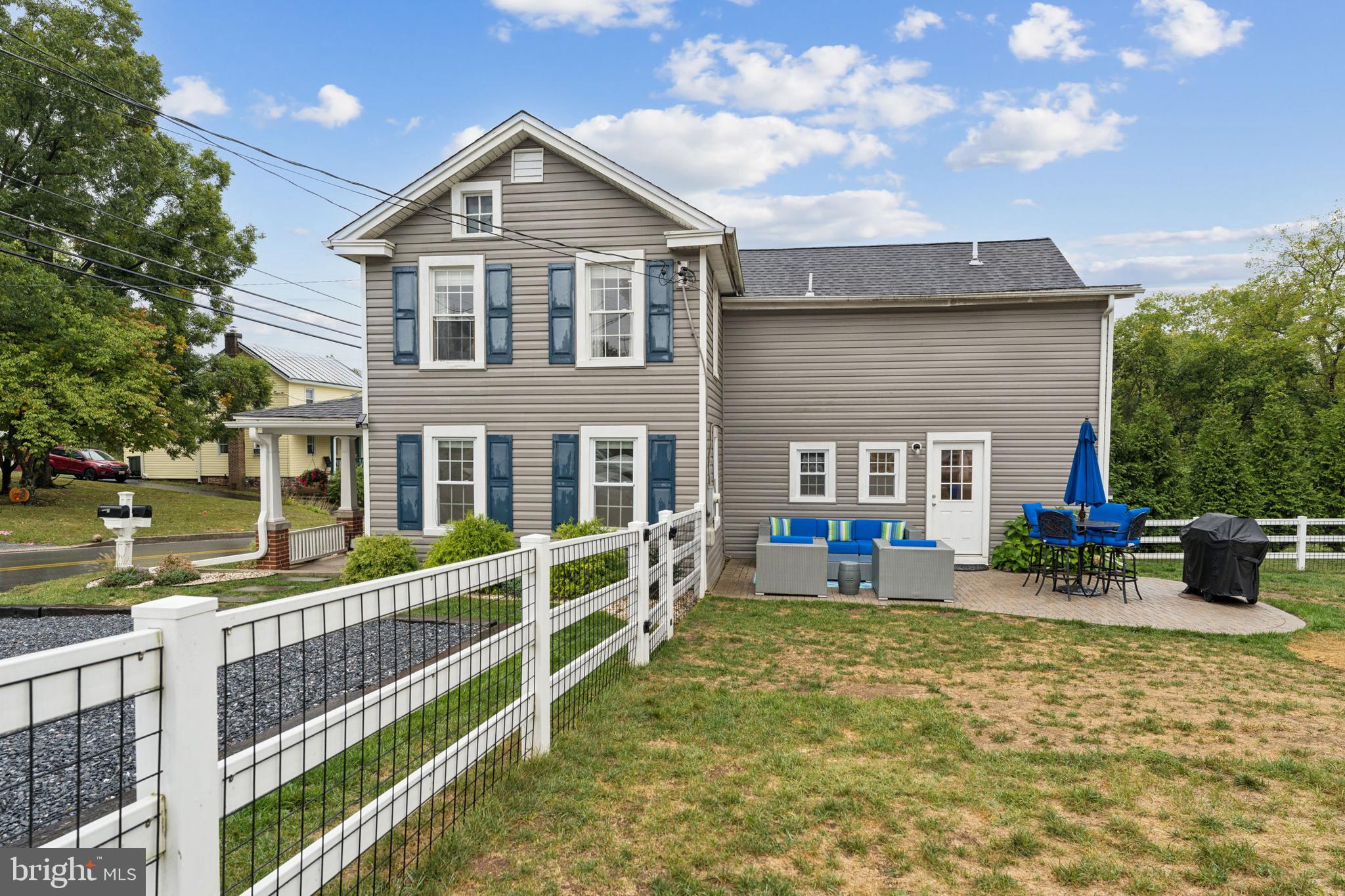 2372 Mayberry Road Westminster, MD 21158 - Photo 34 of 38 a front view of a house with a yard table and chairs