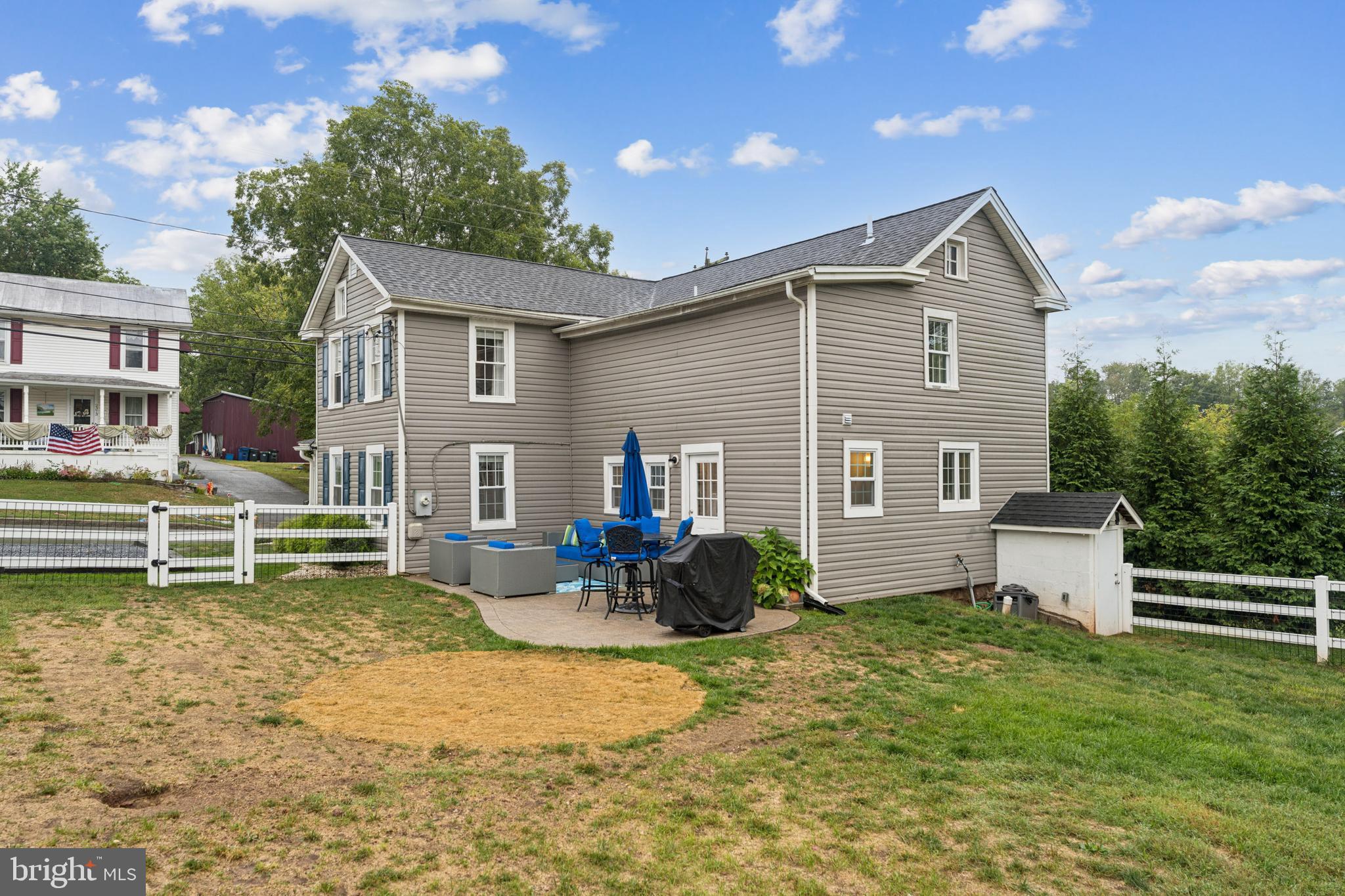 2372 Mayberry Road Westminster, MD 21158 - Photo 35 of 38 a backyard of a house with table and chairs