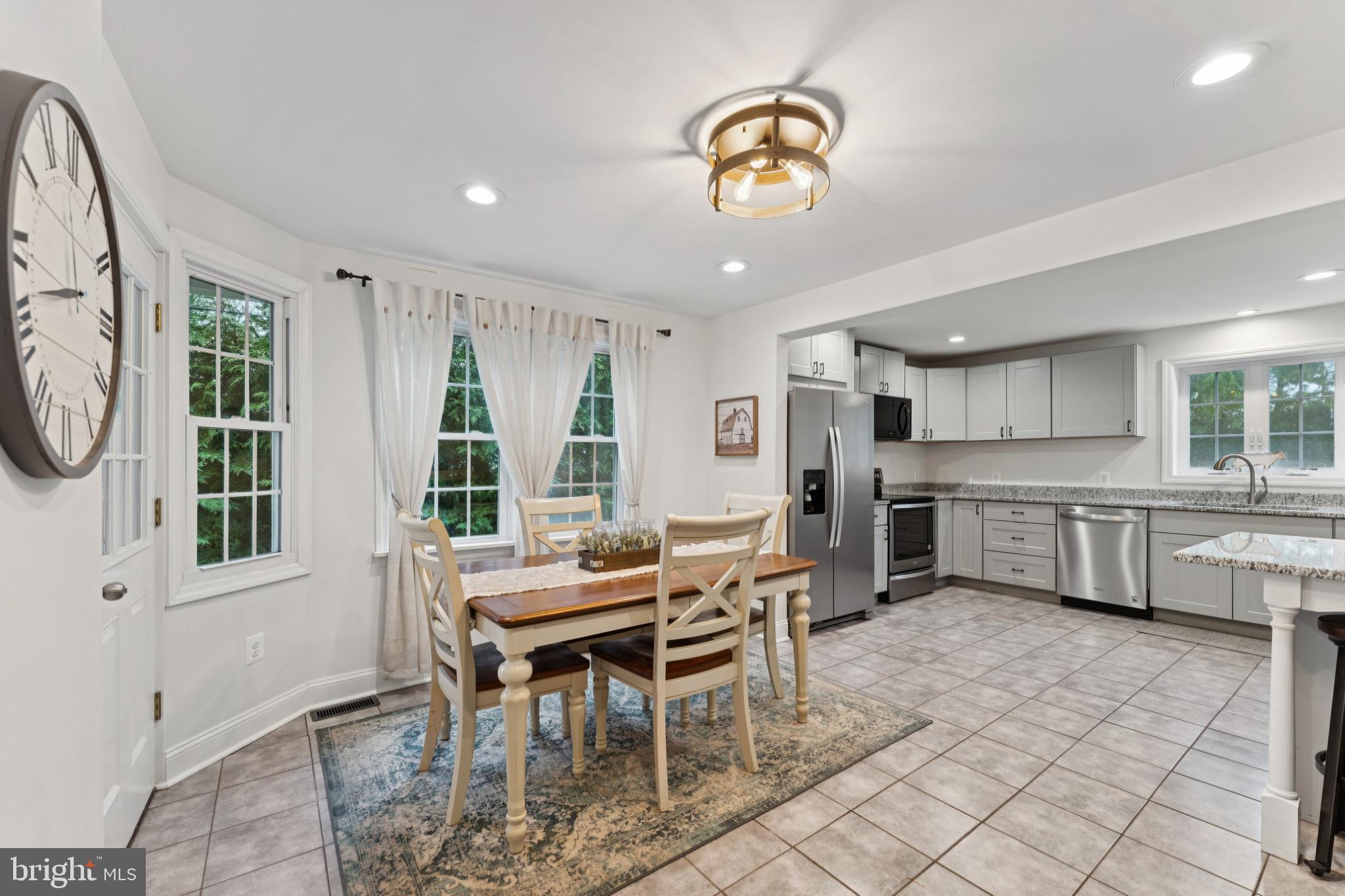 2372 Mayberry Road Westminster, MD 21158 - Photo 7 of 38 a view of a dining room with furniture window and wooden floor