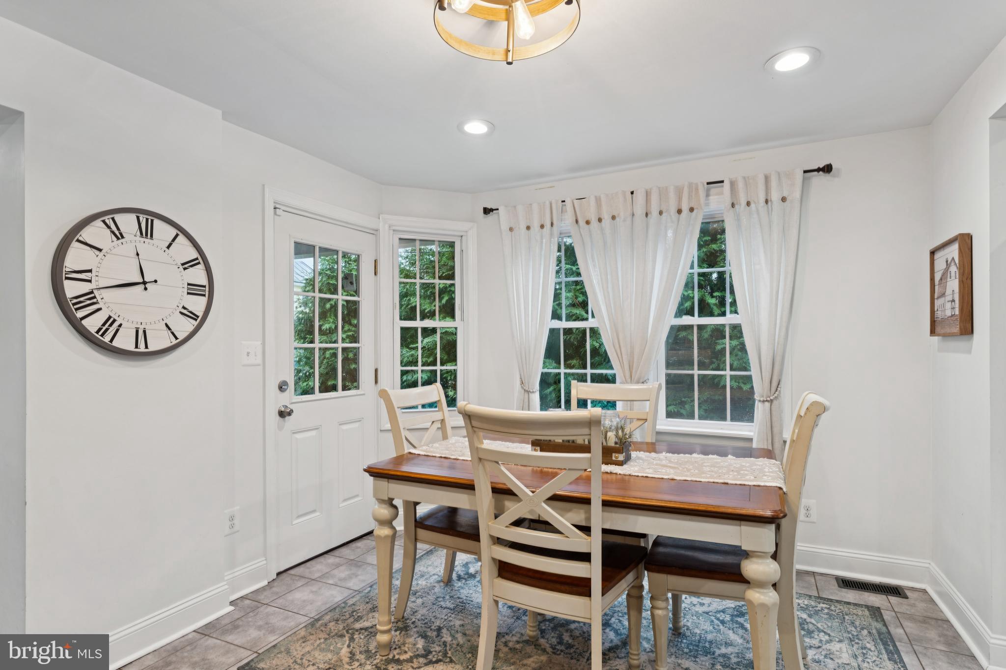 2372 Mayberry Road Westminster, MD 21158 - Photo 8 of 38 a dining room with furniture a rug and a large window