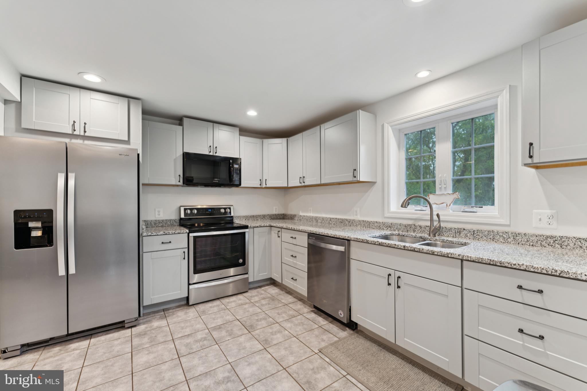 2372 Mayberry Road Westminster, MD 21158 - Photo 10 of 38 a kitchen with a sink stainless steel appliances and window