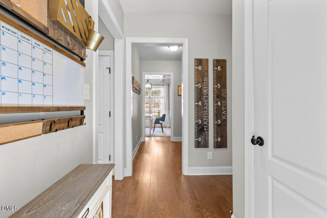 170 Valley Pines Circle Spring Lake, NC 28390 - Photo 13 of 55 a view of a hallway with wooden floor and living room