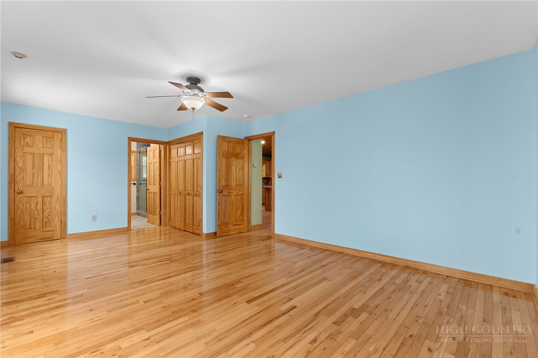 148 Woodby Ridge Road Vilas, NC 28692 - Photo 17 of 33 wooden floor in an empty room with a window