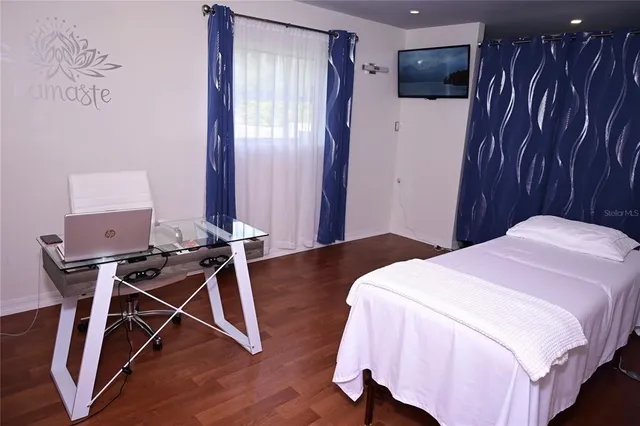 a bedroom with a bed and a table in it