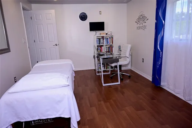 a room with a bed and a chair in it