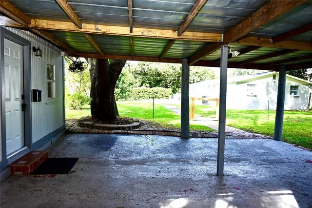 a view of a backyard with porch