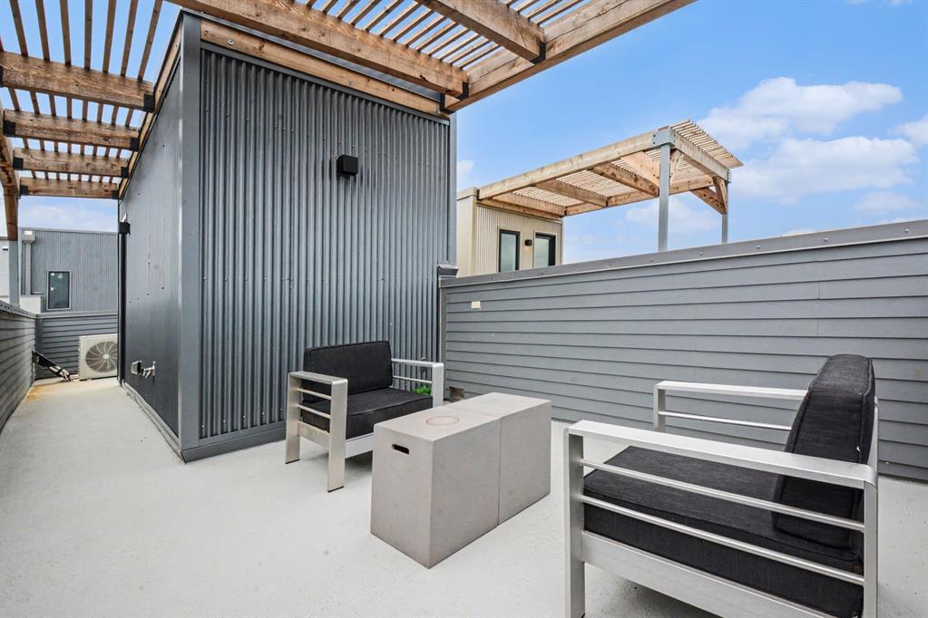 1111 Raiford Road, Unit 121 Carrollton, TX 75007 - Photo 17 of 30 a view of backyard with barbeque grill wooden floor and city view