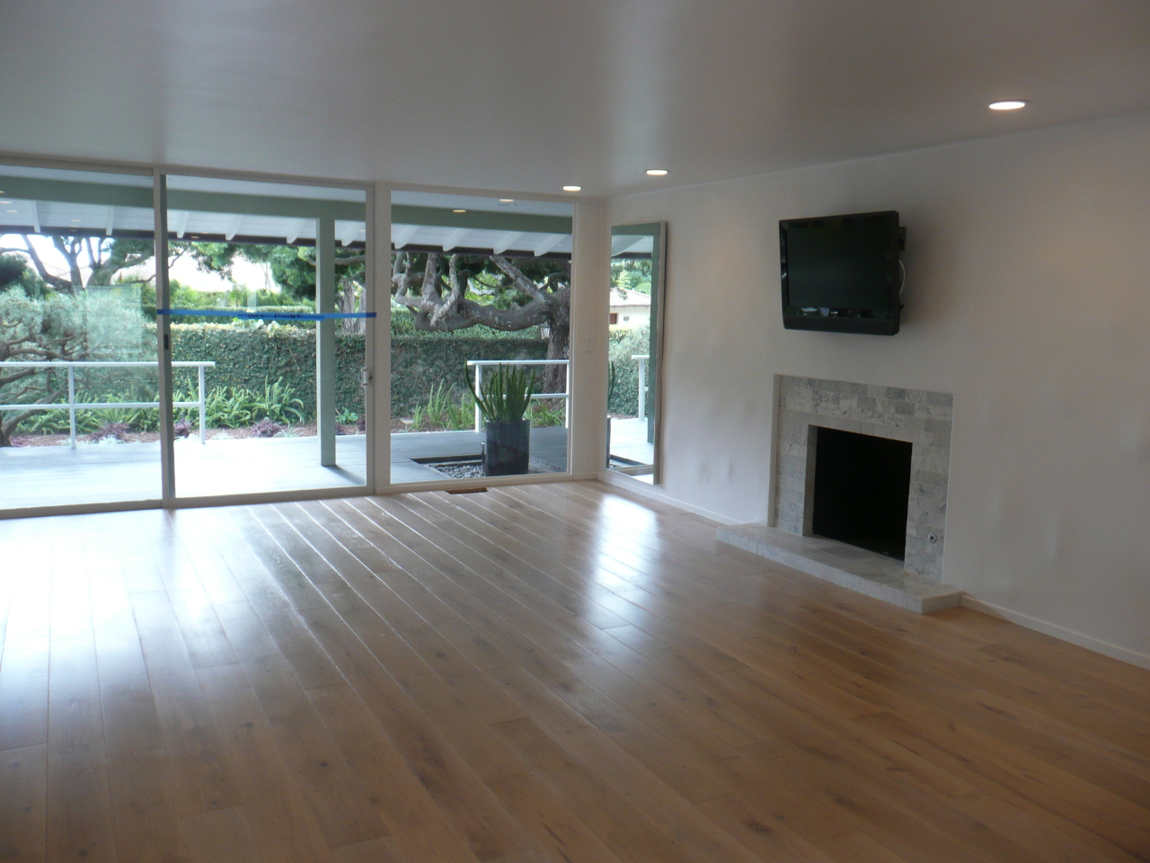 1126 Hill Road Santa Barbara, CA 93108 - Photo 3 of 8 a view of empty room with wooden floor and fireplace