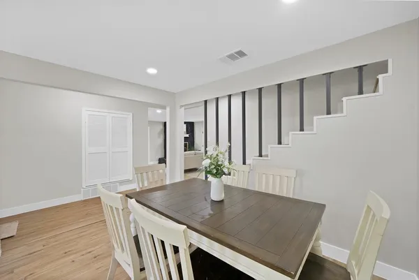 a view of a livingroom with furniture and wooden floor