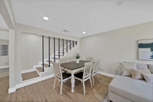 a living room with furniture and a rug
