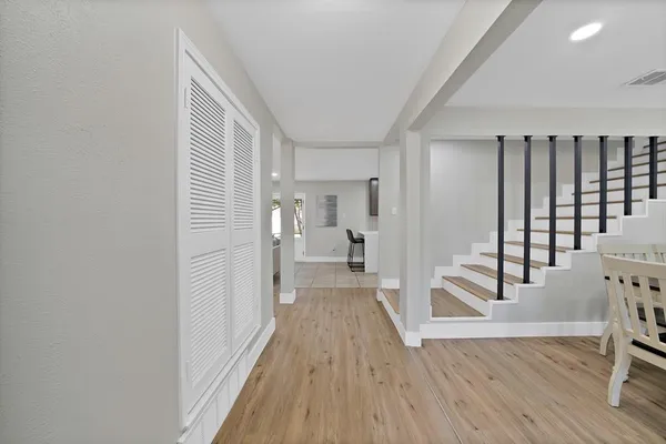 a view of a dining room with furniture and wooden floor