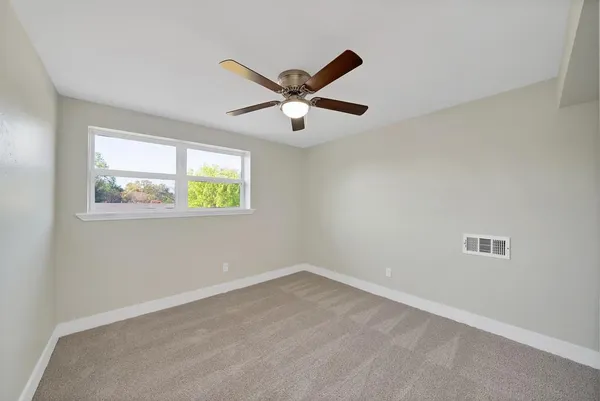 a bathroom with a sink vanity and a mirror