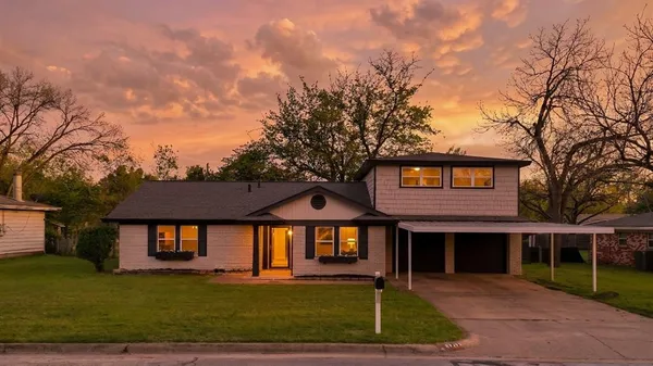 a view of a house with a big yard