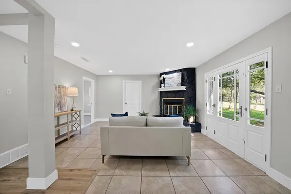 a living room with furniture and a fireplace
