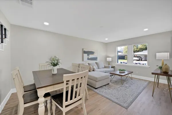 a kitchen with a table and chairs in it