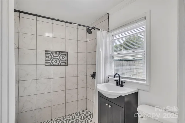 a sink sitting next to a shower