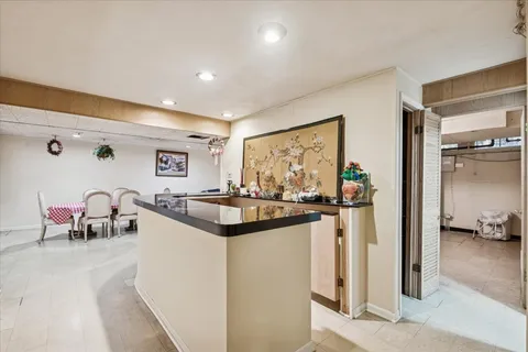 a kitchen with stainless steel appliances granite countertop a sink and cabinets