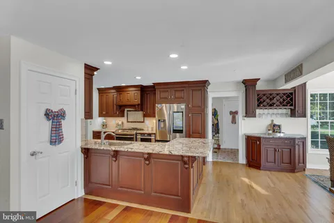 a large kitchen with lots of counter space and stainless steel appliances