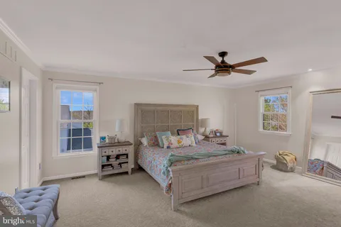 a bedroom with bed and a window
