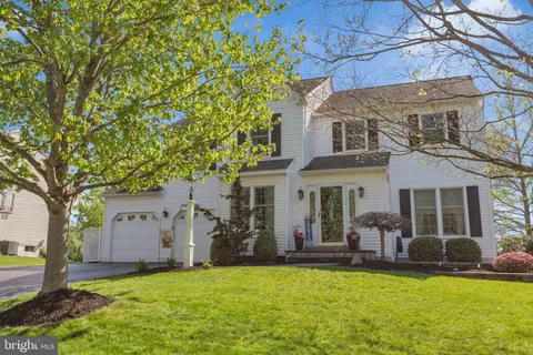 a view of a house with a yard porch and sitting area