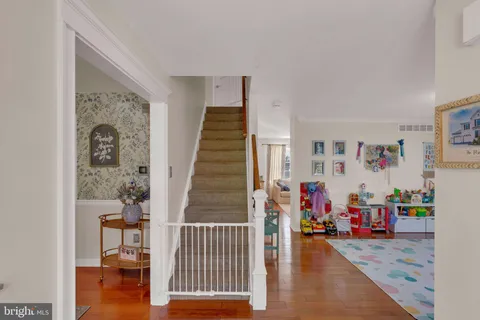 a view of a livingroom with furniture and staircase