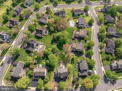 an aerial view of houses with yard