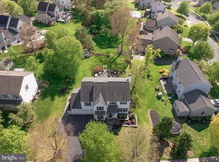 an aerial view of a house with yard swimming pool and outdoor seating