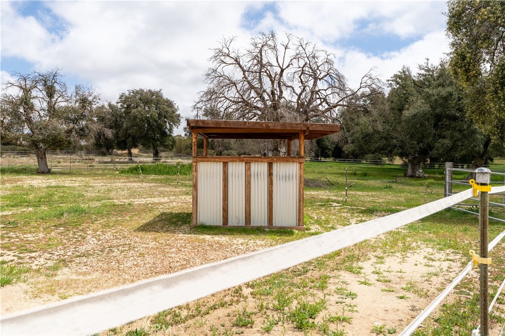 29972 Chihuahua Valley Road Warner Springs, CA 92086 - Photo 37 of 55 a view of a swimming pool with a bench and trees around